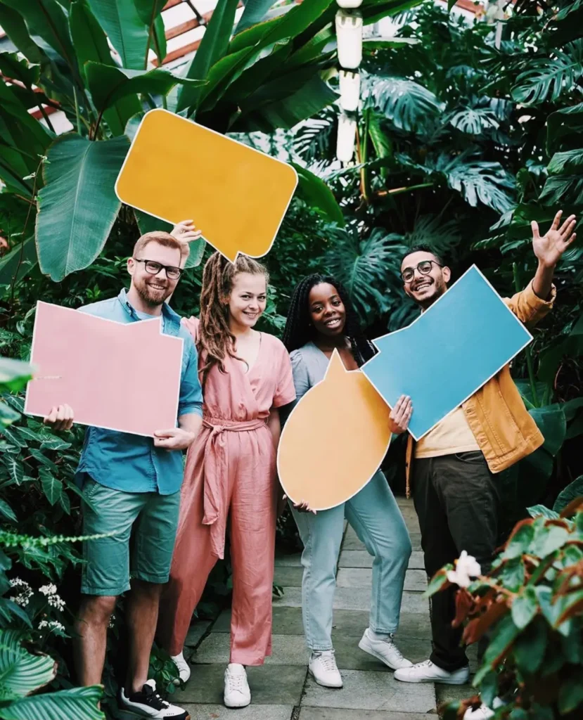 target audience for digital marketing. A diverse group holding signs and comment bubbles in a jungle background